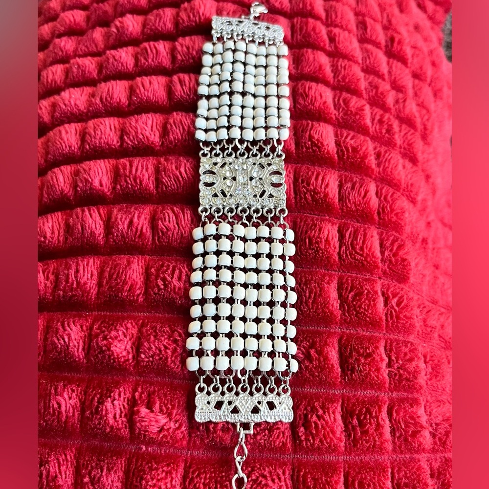 VCLM vintage bracelet. Off-white enamel with tiny, rhinestones in center.